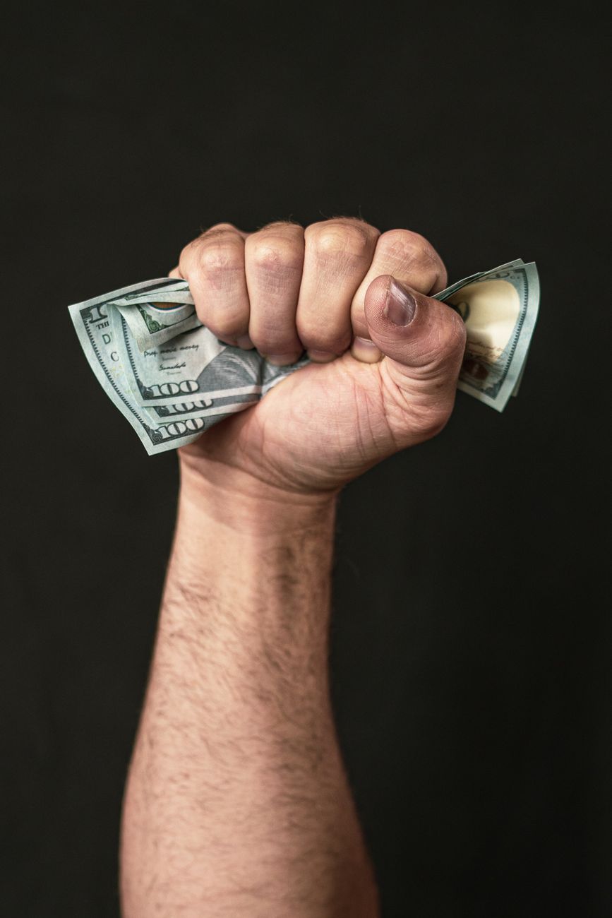 person holding dollar bills